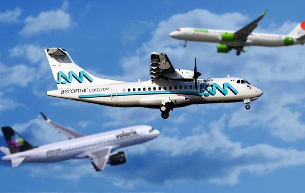 Tres aviones sobrevolando, uno de ellos de la empresa Aeromar.